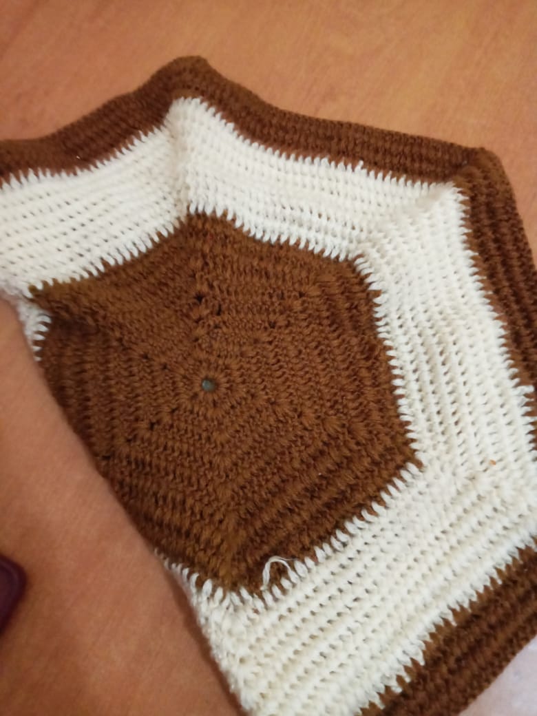 Brown and white crochet granny square